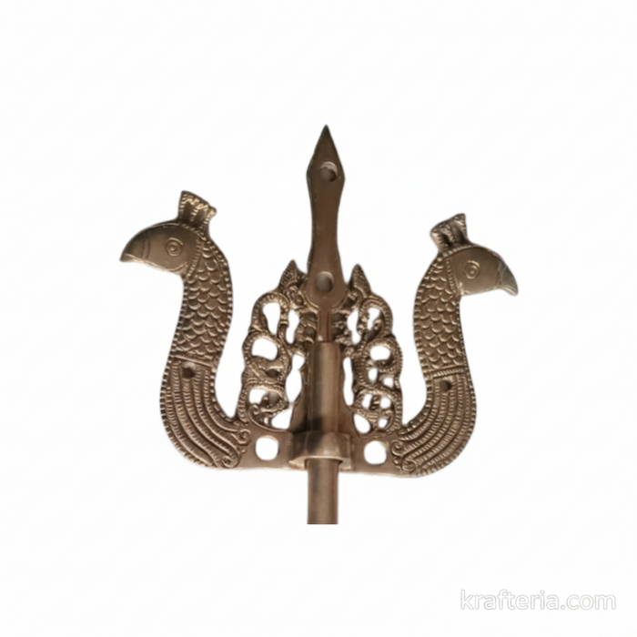 Antique brass door latch with trishul design, traditional decorative door hardware.