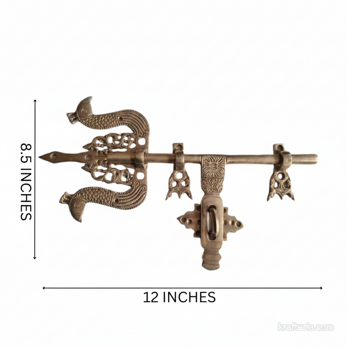 Antique brass door latch, a traditional trishul design with ornate decorative hardware.
