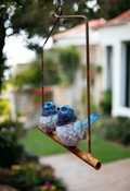 BLUE WREN PAIR ON A RUSTED HANGING FRAME