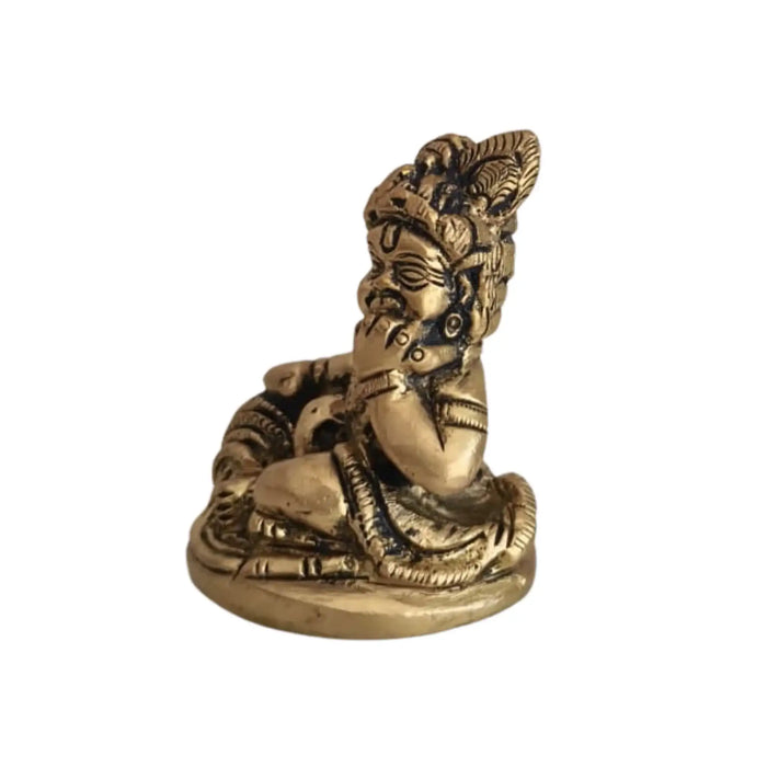Brass Bal Krishna idol, a divine baby Krishna figurine holding a butter ball.