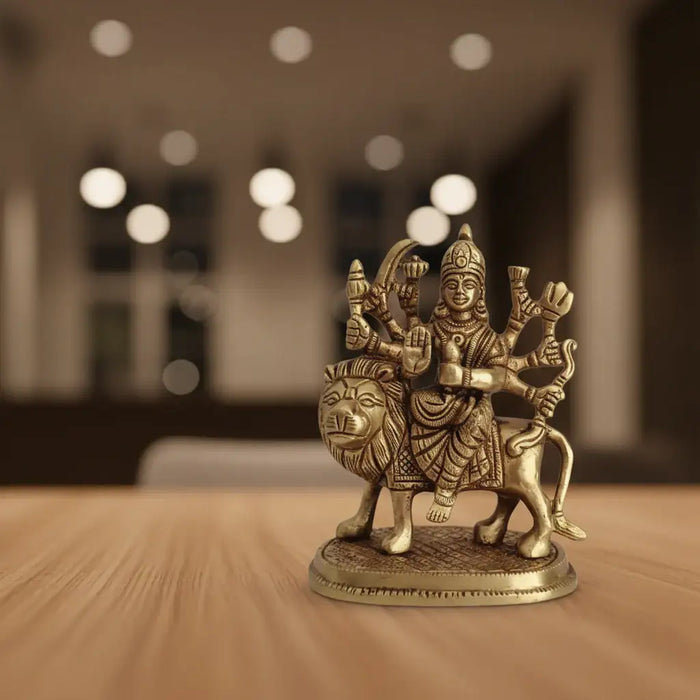 Brass Goddess Durga Idol, divine protector, riding lion, destroying evil.