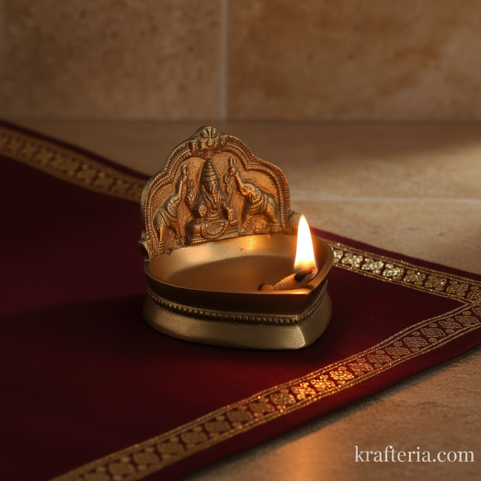 Gajalakshmi brass diya with Goddess Lakshmi and elephants, a decorative oil lamp.