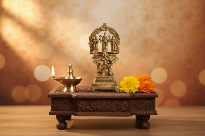 Brass Garuda Vishnu idol with Sridevi and Bhudevi, Hindu temple sculpture.
