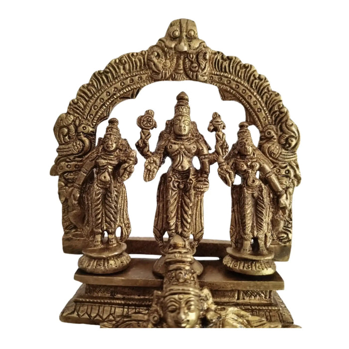 Brass Garuda Vishnu idol with Sridevi & Bhudevi, detailed Hindu temple sculpture.