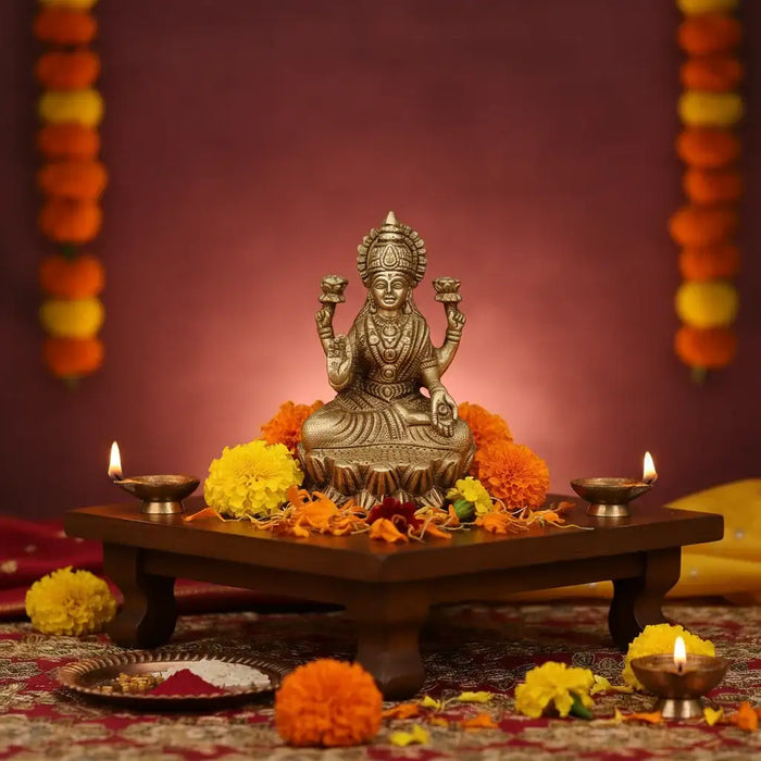 Brass Goddess Lakshmi Idol seated on a lotus, four-armed deity in brass.