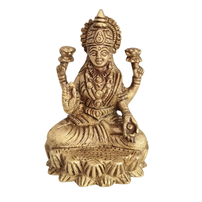 Brass Goddess Lakshmi Idol seated on a lotus, four-armed deity, brass ware.
