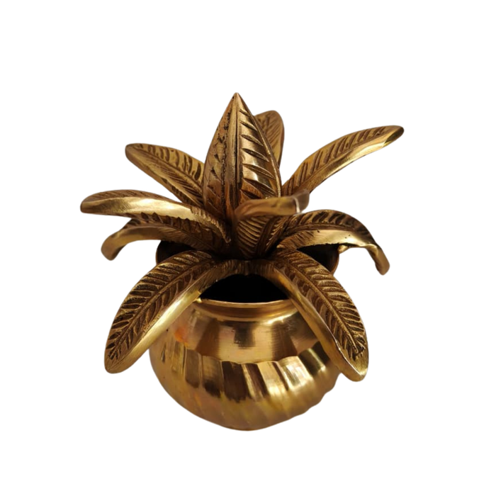 Ornate brass kalasha with lotus leaves, a traditional brass kalasha with lotus detail.