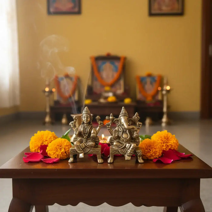 Brass Lakshmi and Ganesha idols, traditional Hindu deities.