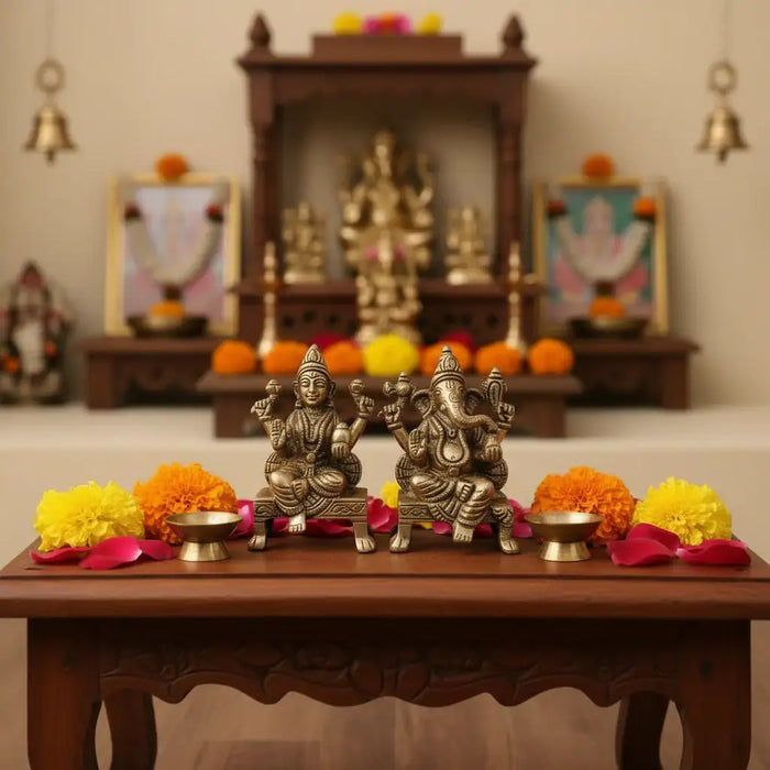 Brass Lakshmi and Ganesha idols, intricate details, divine prosperity symbols.