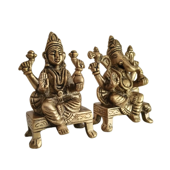 Brass Lakshmi and Ganesha idols for worship.