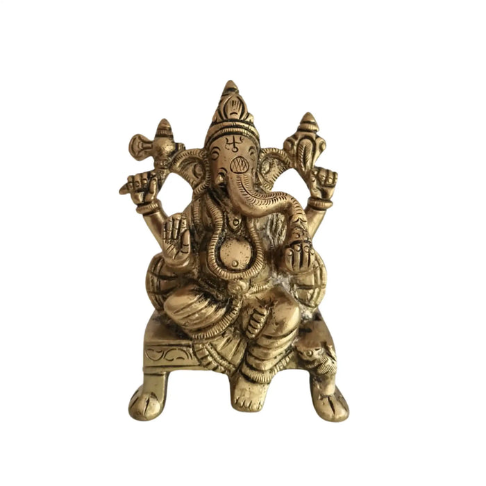 Brass Lakshmi and Ganesha idols, sacred figurines for prosperity and good fortune.