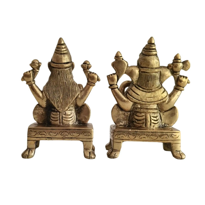 Brass Lakshmi and Ganesha idols, representing prosperity and good fortune.