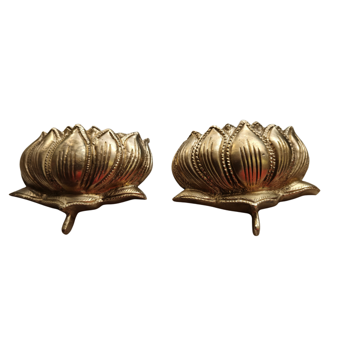 Brass lotus altar set with two sacred flower pieces for home decor.