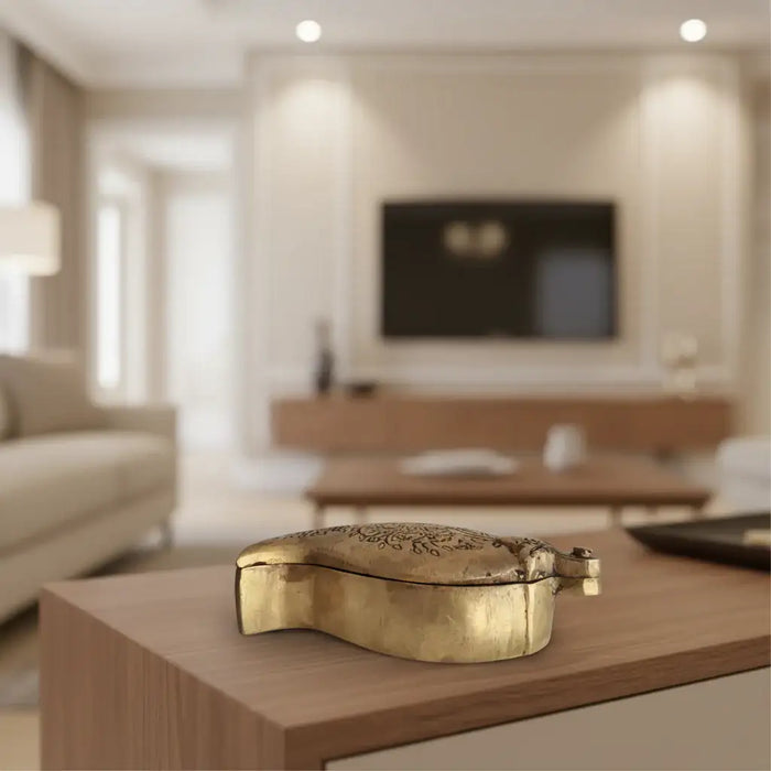 Mango shaped decorative box in engraved brass with lid for storage.