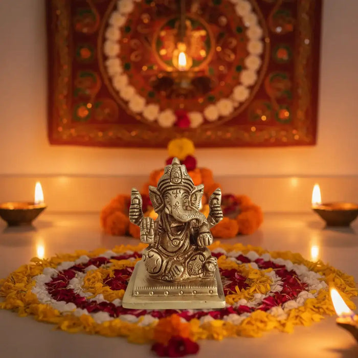 Miniature Lord Ganesha Idol in brass, four-armed bringer of success and wisdom.