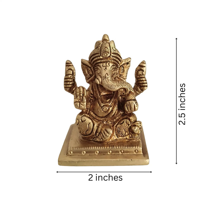 Miniature Lord Ganesha Idol in brass, four-armed, symbolizing success and wisdom.