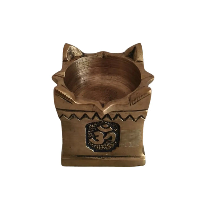 Intricate brass multi wick diya with Om symbols for religious worship.