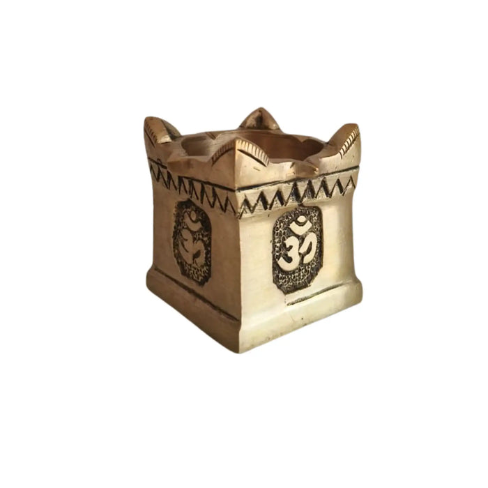Brass multi wick diya with Om symbols, a decorative religious lamp.