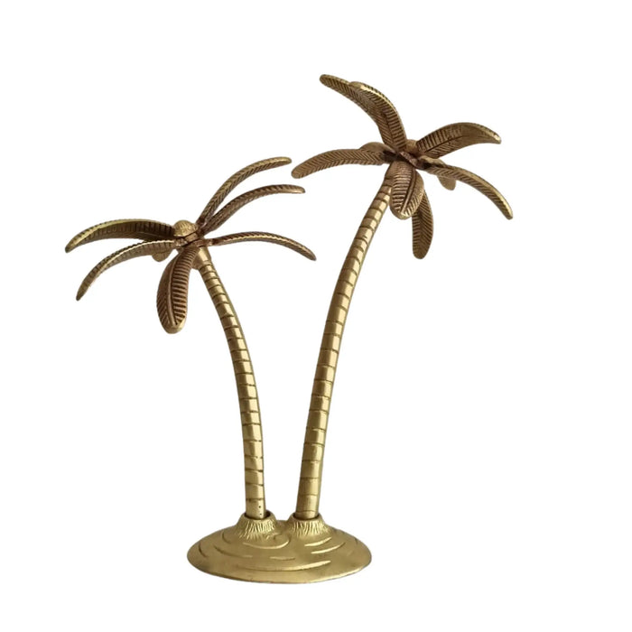 A detailed brass palm tree decor tabletop accent for tropical home decor.