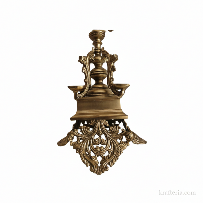 Elegant brass peacock diya with four wicks, a stunning decorative oil lamp.