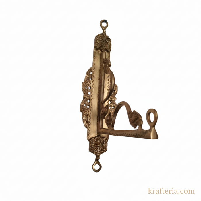 Decorative brass peacock hook for wall hanging.