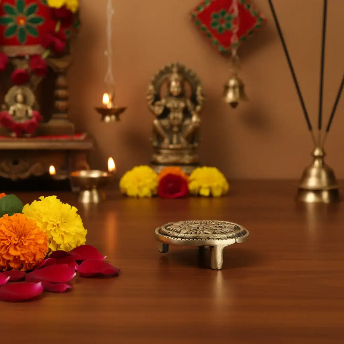 Brass pedestal stand, a round brass ritual holder for ceremonies.