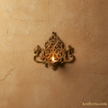 Intricate brass shankh chakra diya with filigree detailing, a traditional decorative lamp.