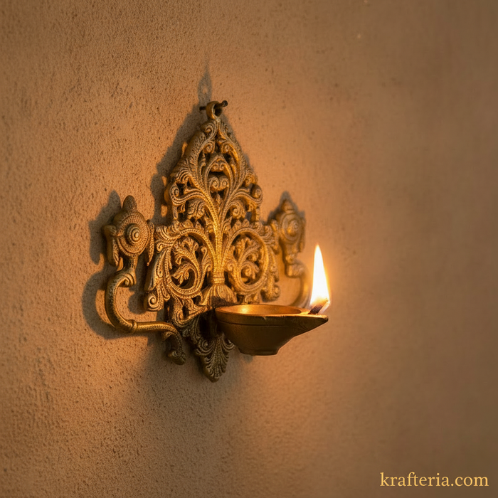 Decorative brass shankh chakra diya with intricate filigree work.