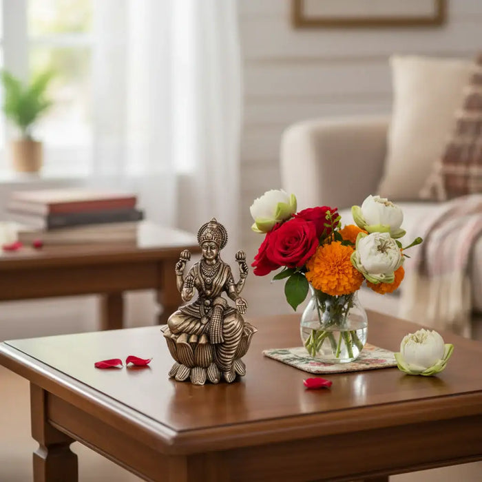Classic Four-Armed Brass Lakshmi Idol Seated on Lotus - Symbol of Prosperity   Brass Ware