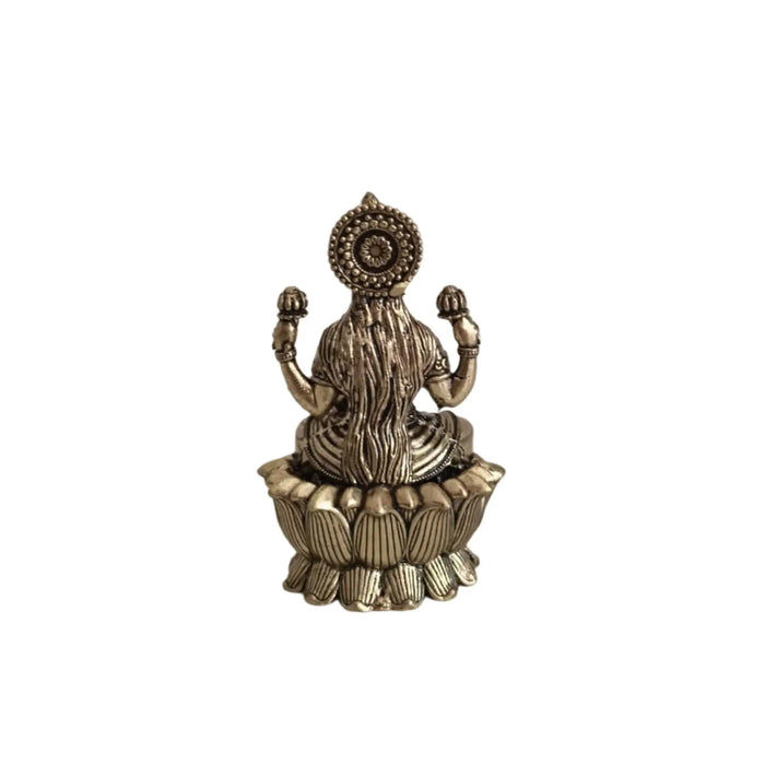 Classic Four-Armed Brass Lakshmi Idol Seated on Lotus - Symbol of Prosperity   Brass Ware