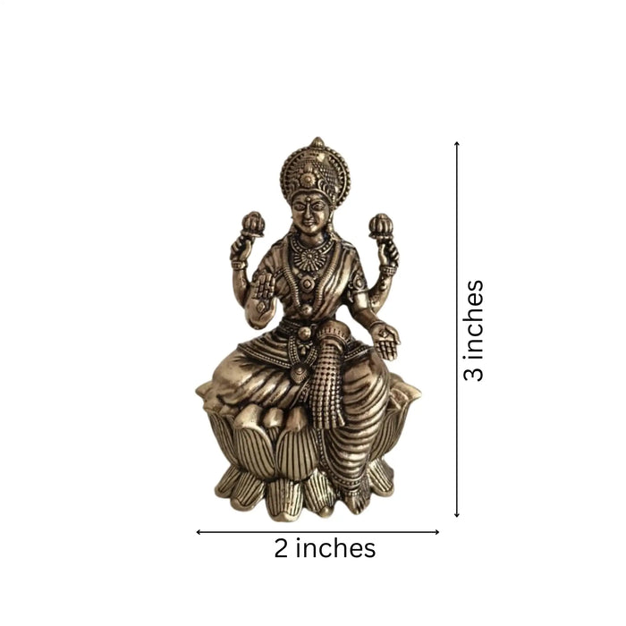 Classic Four-Armed Brass Lakshmi Idol Seated on Lotus - Symbol of Prosperity   Brass Ware