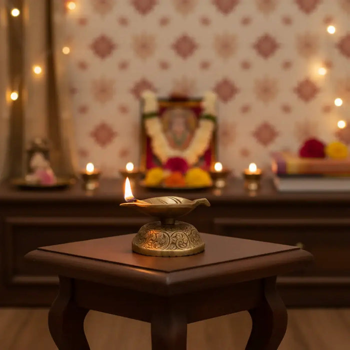Elegant Brass Leaf-Shaped Diya with Carved Base   Brass Ware