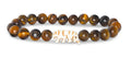 Fahlo Prowl Tiger’s Eye bracelet with tiger charm and natural stone beads that tracks a real tiger