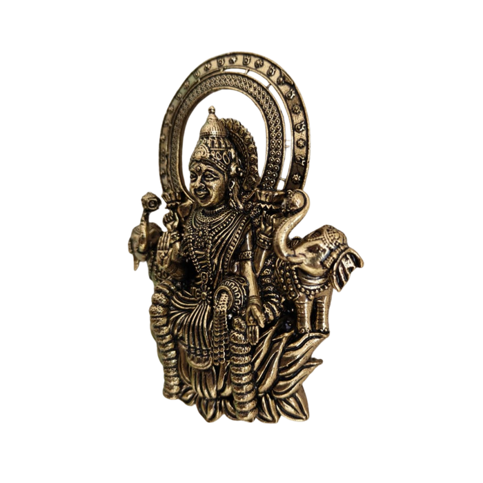 Brass Gajalakshmi wall hanging, a detailed brass finish wall art.