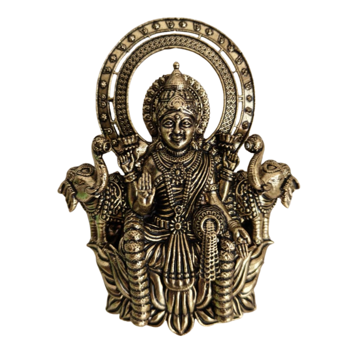 Brass Gajalakshmi wall hanging with intricate details and brass finish.