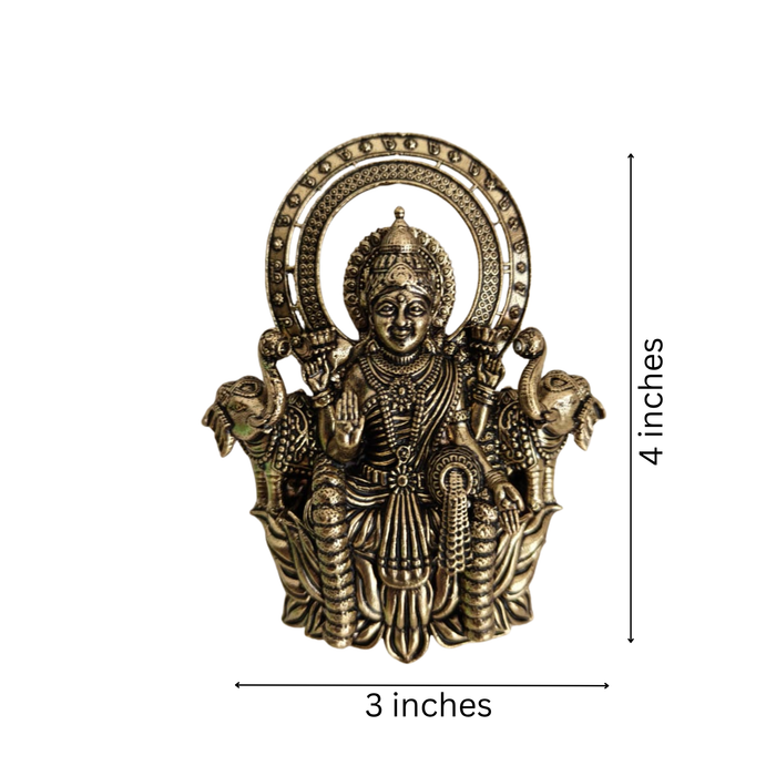 Brass Gajalakshmi wall hanging, ornate brass finish, traditional Indian deity art.