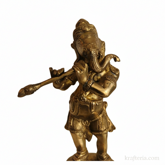 Lord Ganesha flute idol in brass on altar for home decor and gifting.