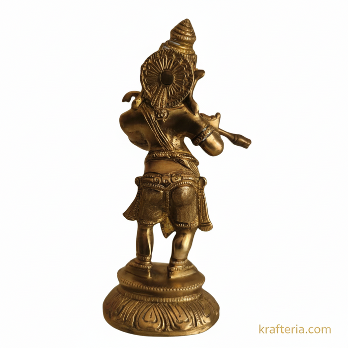 Golden lord ganesha flute idol on brass altar, perfect for home decor and gifting.