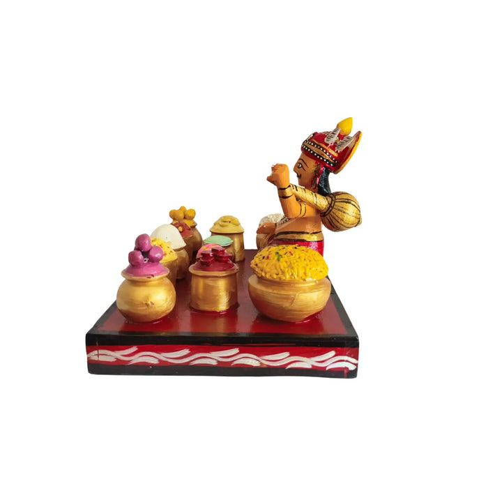 Ghatotkacha Kondapalli Eating Doll set in traditional epic art style, feasting.