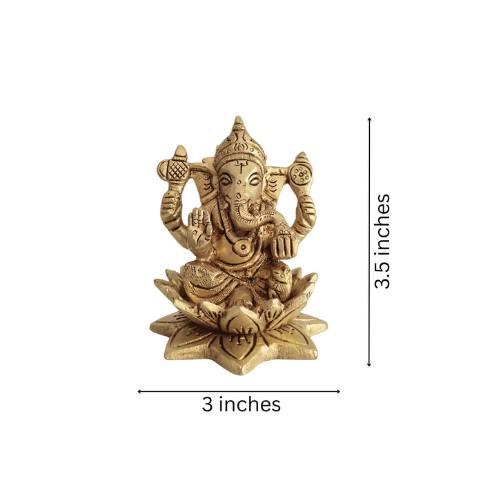 Golden Brass Ganesha Idol Seated on a lotus flower.