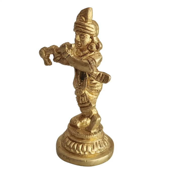Golden brass Lord Krishna idol playing flute, a beautiful brass murti.