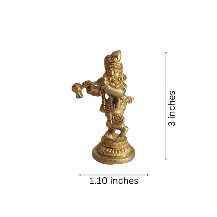 Golden brass Lord Krishna idol playing flute.