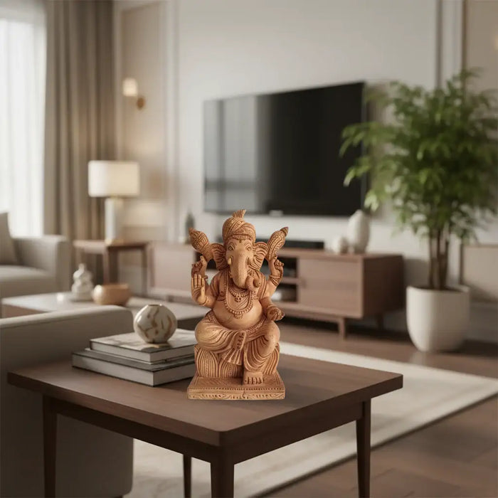 Hand-carved wooden statue of Lord Ganesha, seated with intricate details and traditional attire, against a light background.