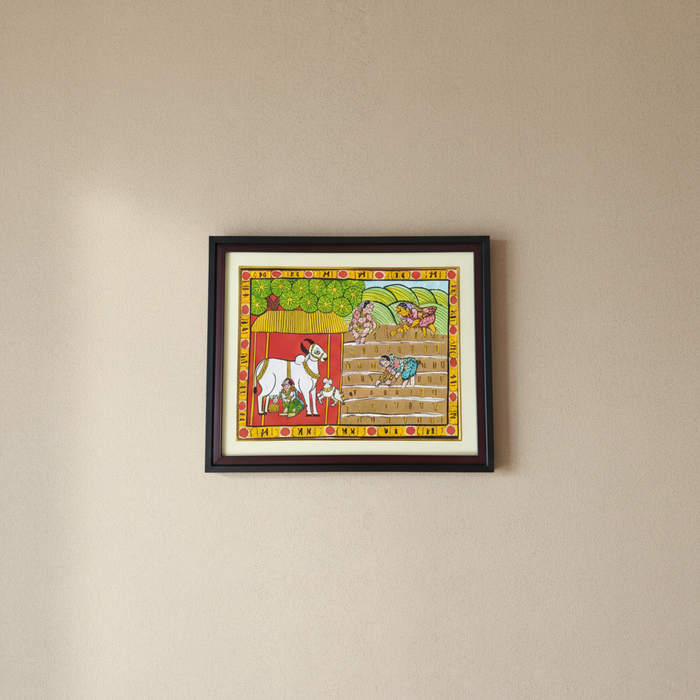 Paddy harvest Cheriyal painting depicting farmers and cattle.