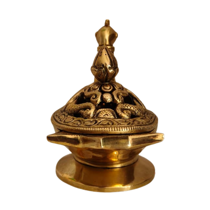 Handcrafted brass peacock artifact with engraved lid.
