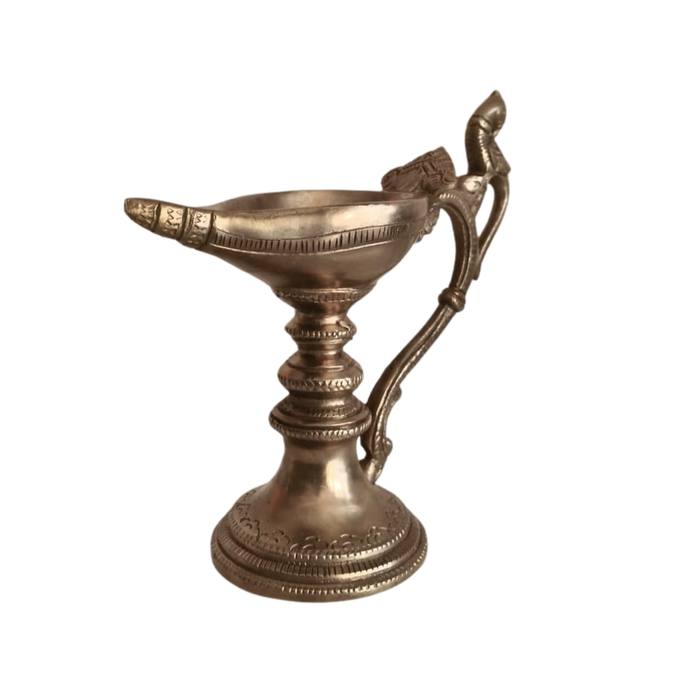 Handcrafted hanging peacock diya oil lamp, a traditional brass decorative piece.