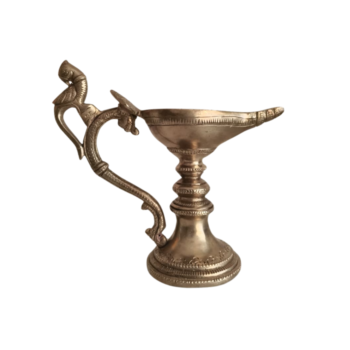 Handcrafted hanging peacock diya, a traditional brass oil lamp for home decor.