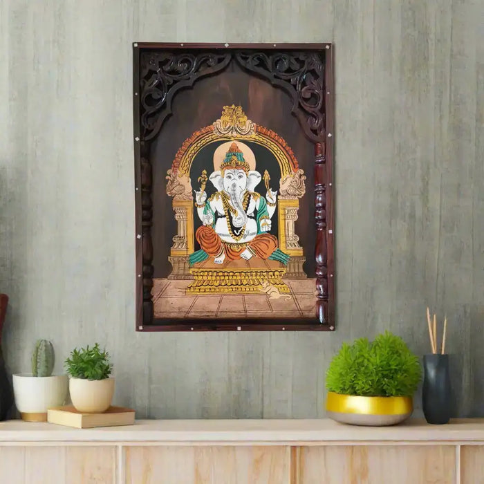 Intricate rosewood ganesha inlay temple frame, handcrafted art.
