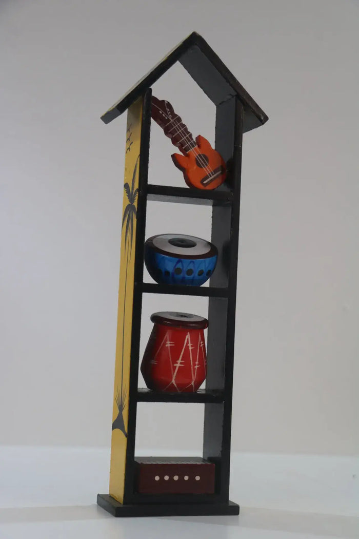 Decorative shelf with musical instrument models on a plain background