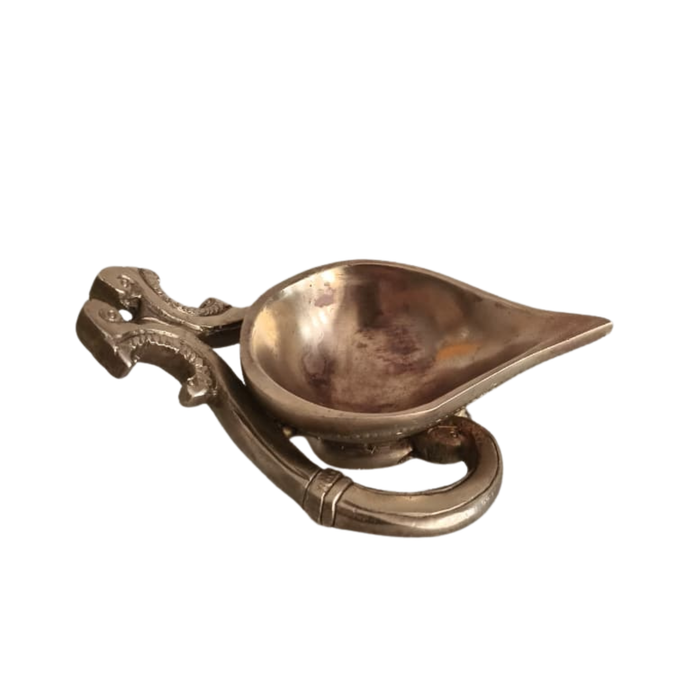 Handcrafted Brass Diya, intricately designed decorative brass lamp by Thar.